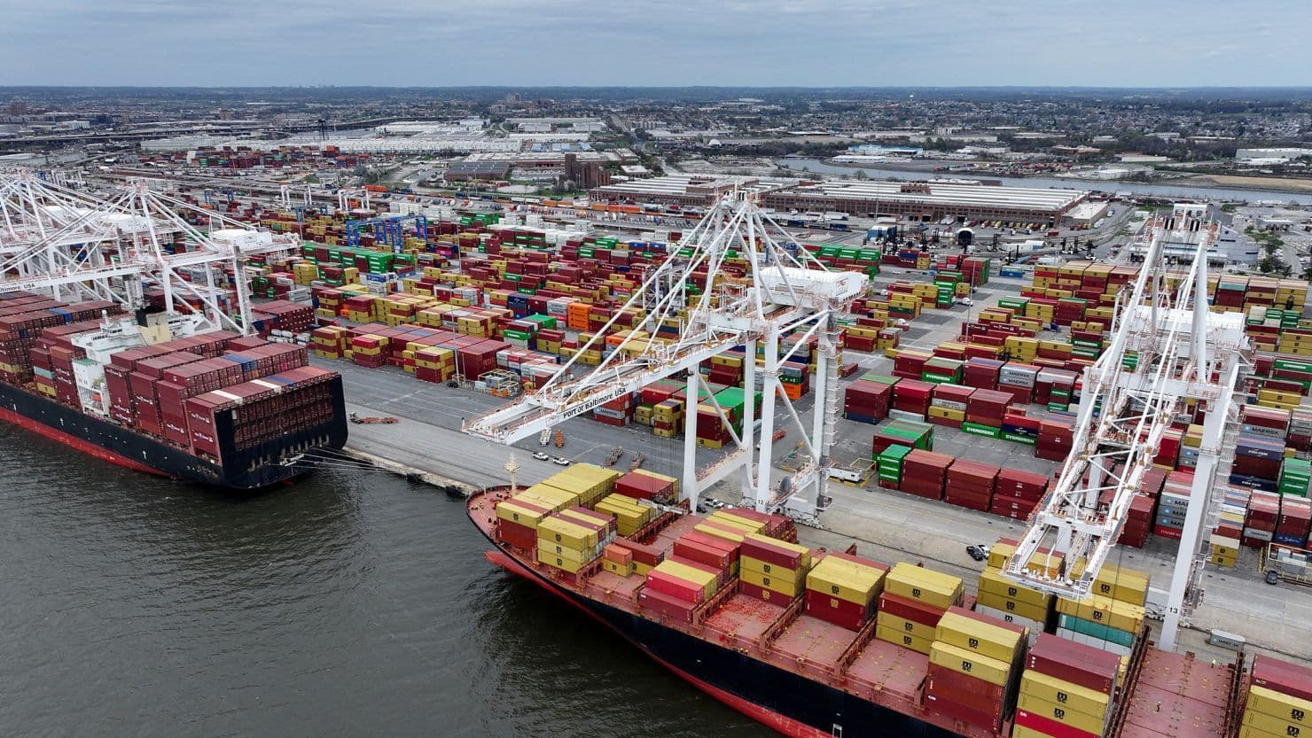 Ships with shipping containers in a port.