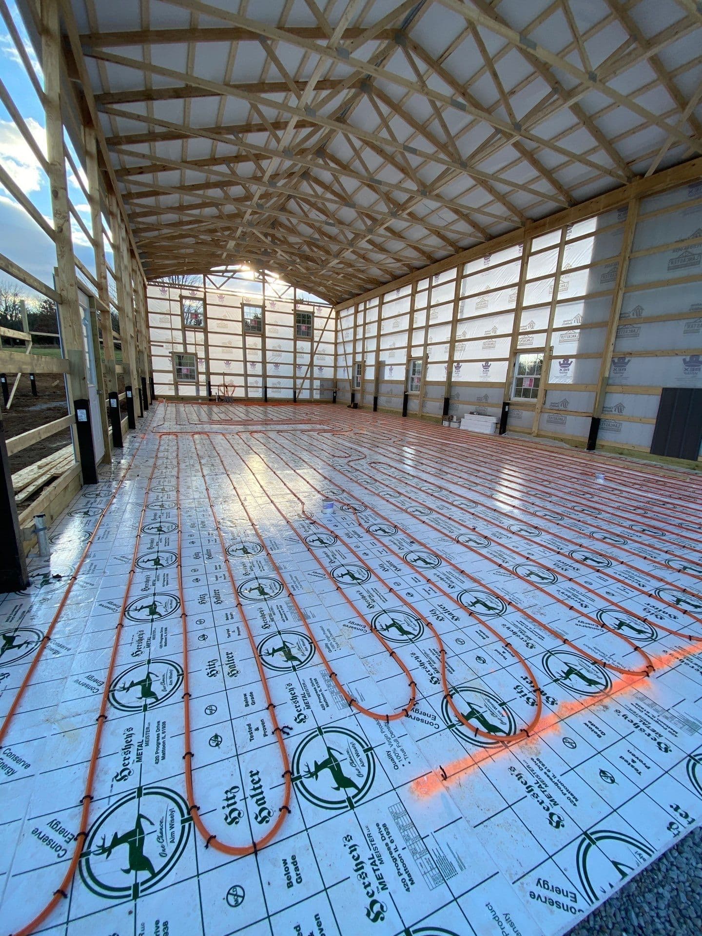 A heating system being installed in a post frame building.
