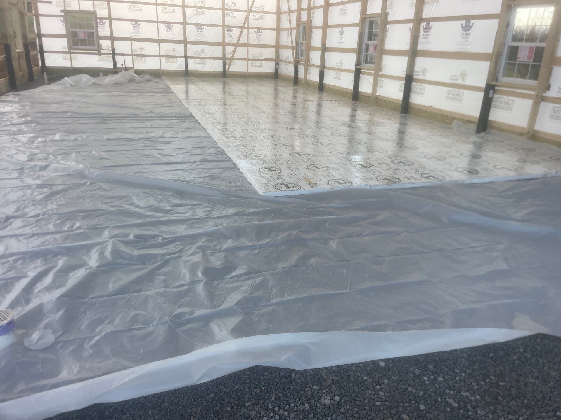 A heating system being installed in a post frame building.