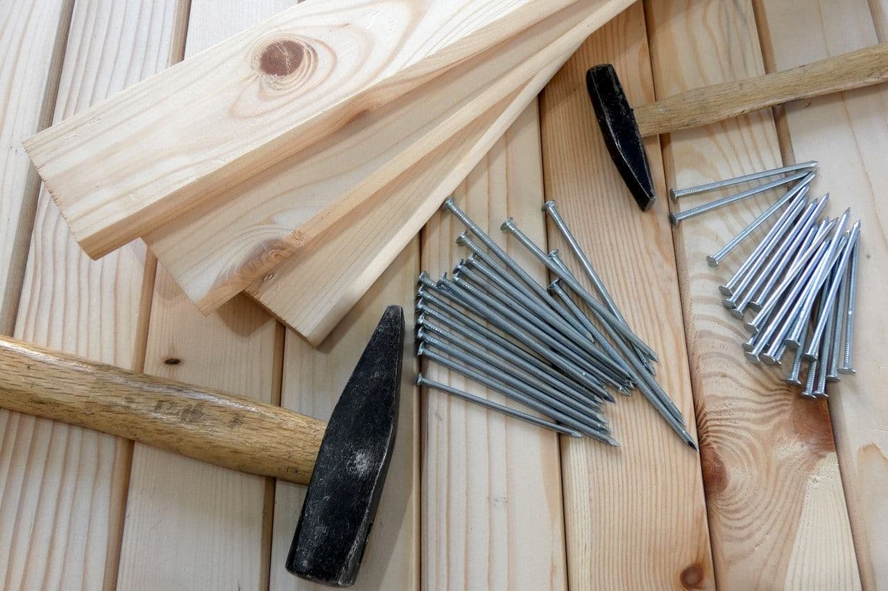 Carpentry supplies sit on some lumber.
