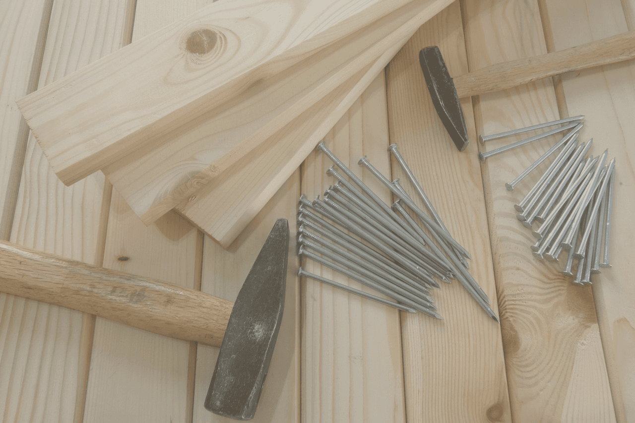 Carpentry supplies sit on some lumber.