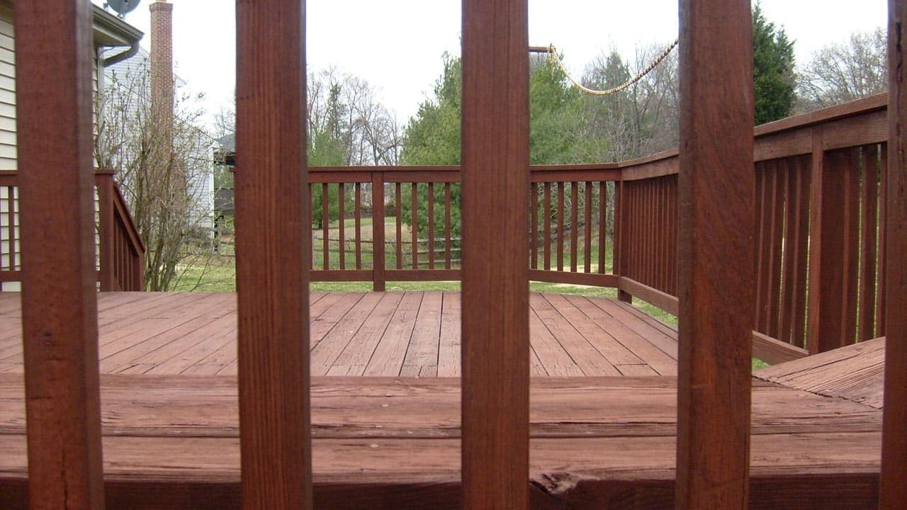 A deck viewed through its railing.