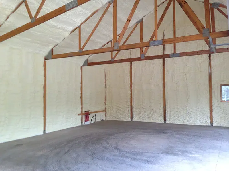 Newly-installed insulation in a post frame building.