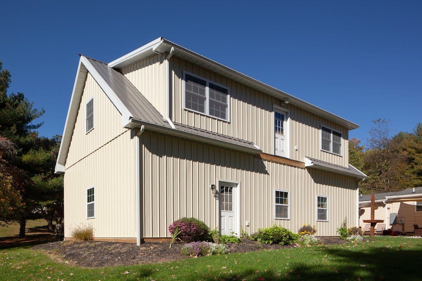 A cream-colored custom pole building.