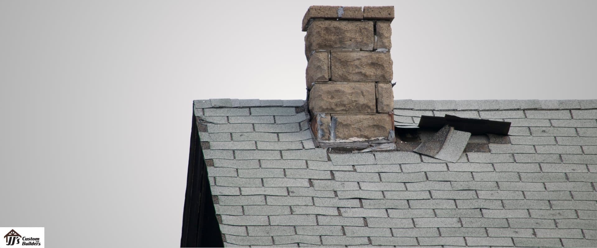 A damaged asphalt roof.