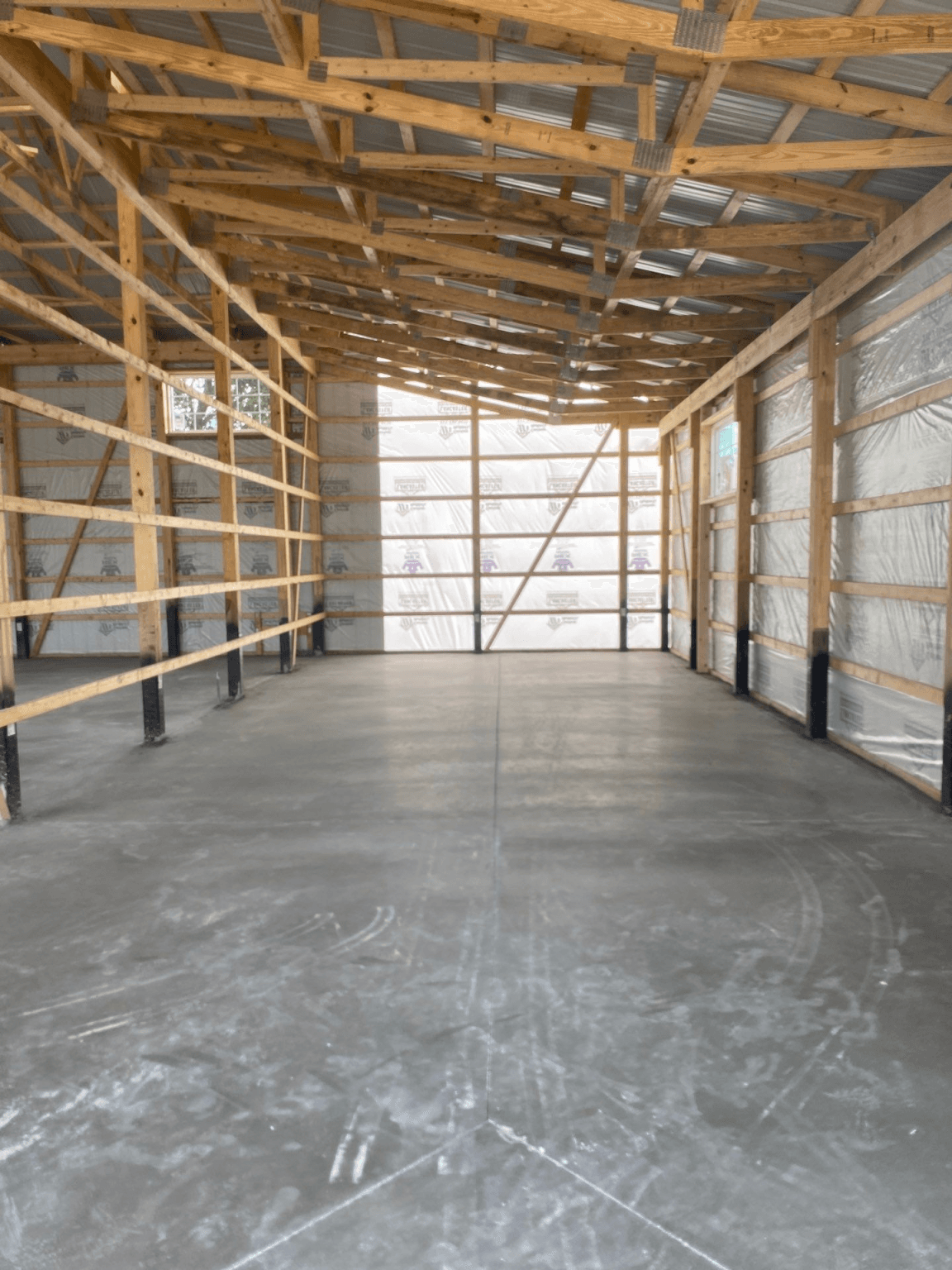 A pole barn mid-construction.