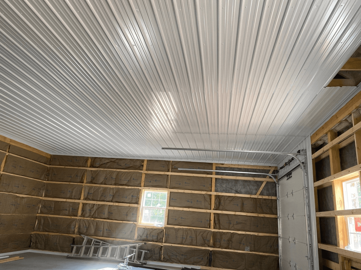 A pole barn mid-construction.