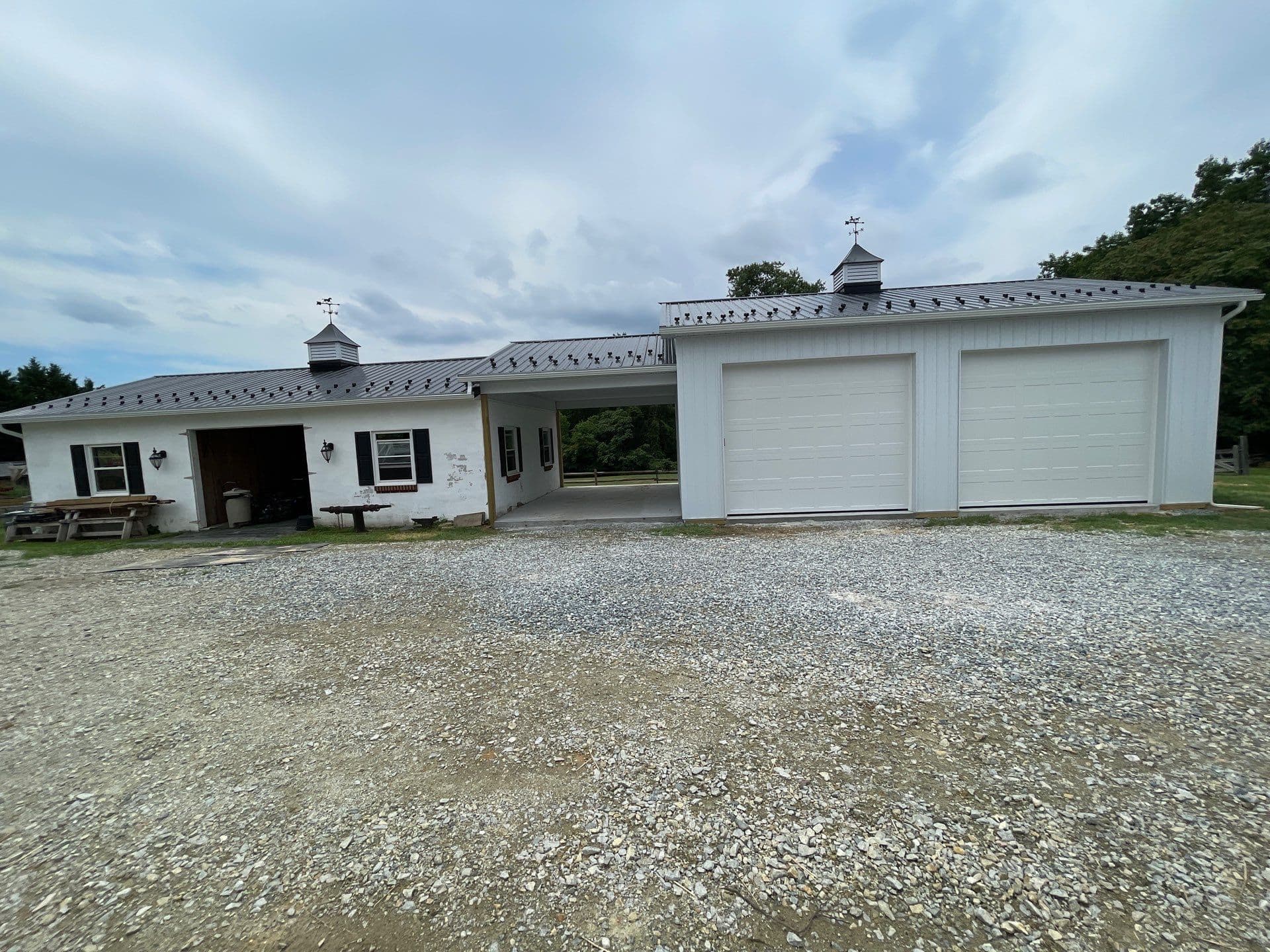 A white post frame building.