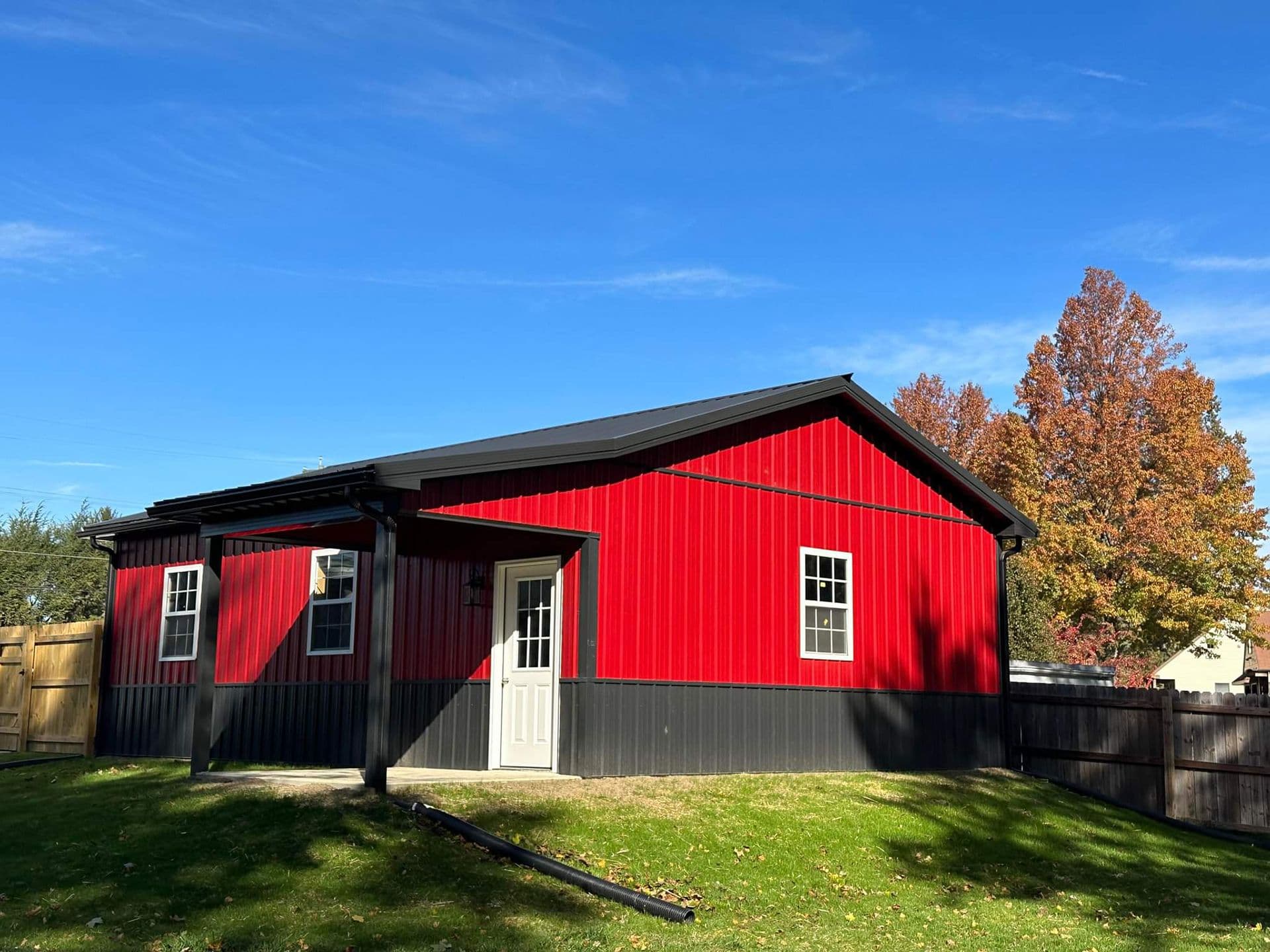 A red and black Post Frame Building.