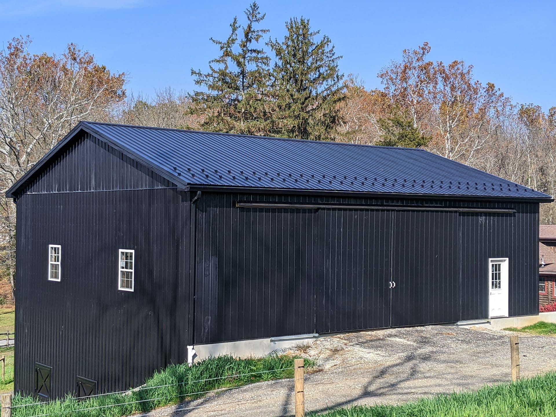 A black Post Frame Building.