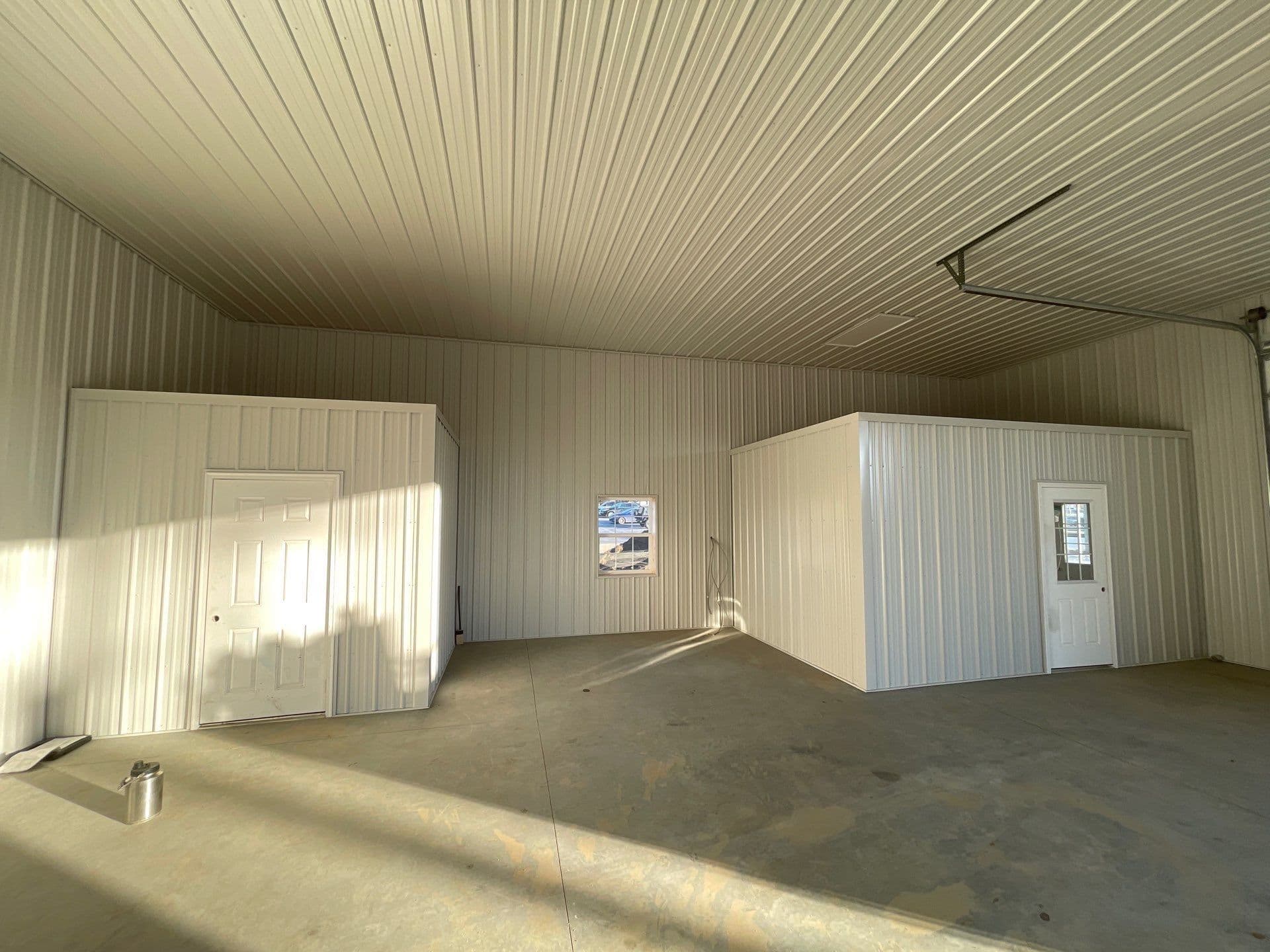 A post frame building with a metal interior.