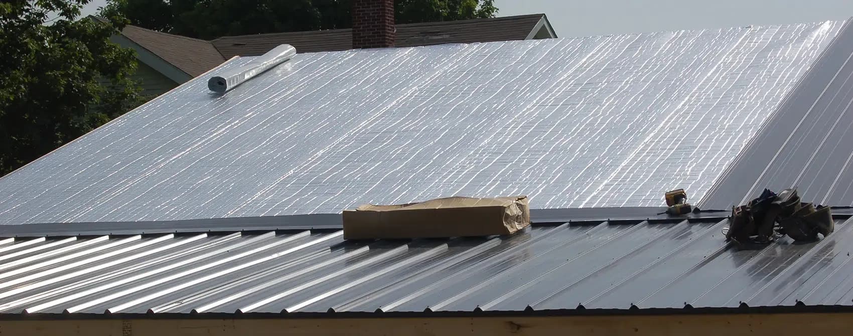 A vapor barrier is installed on a roof.